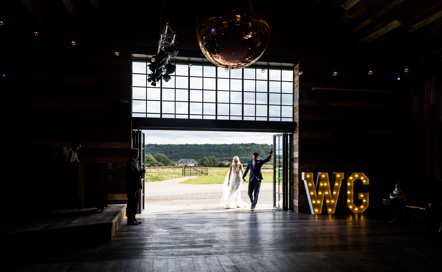 bride and groom enter the reception hall at Wharfedale Grange