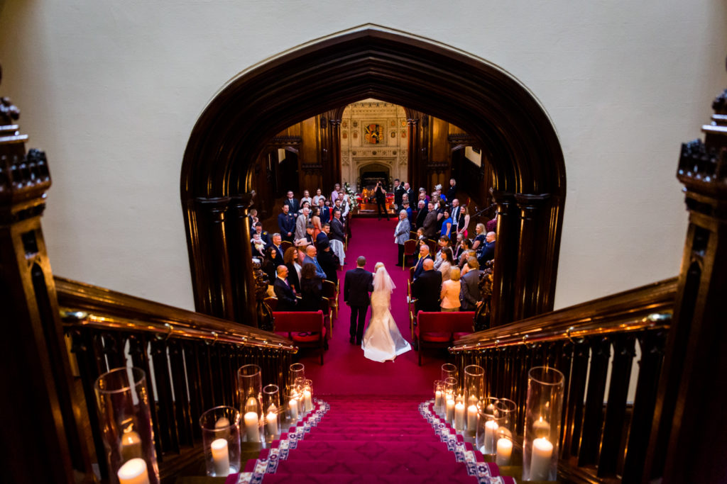 Allerton Castle Wedding Photography - Bride and her Dad walking down the grand staircase
