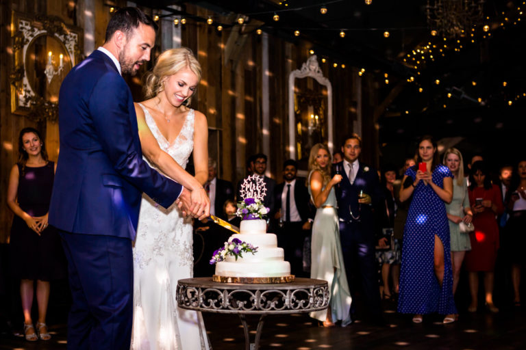 wedding couple cutting the cake at Wharfedale Grange