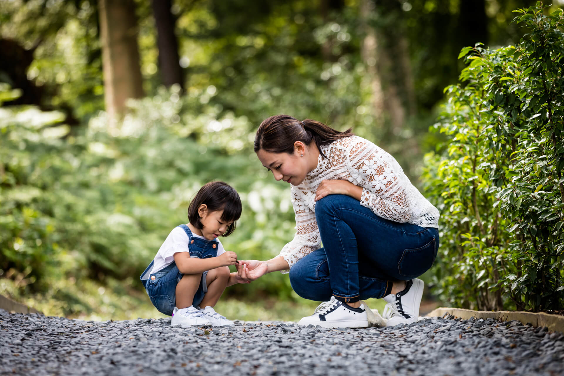 A mother and child playing in a park.