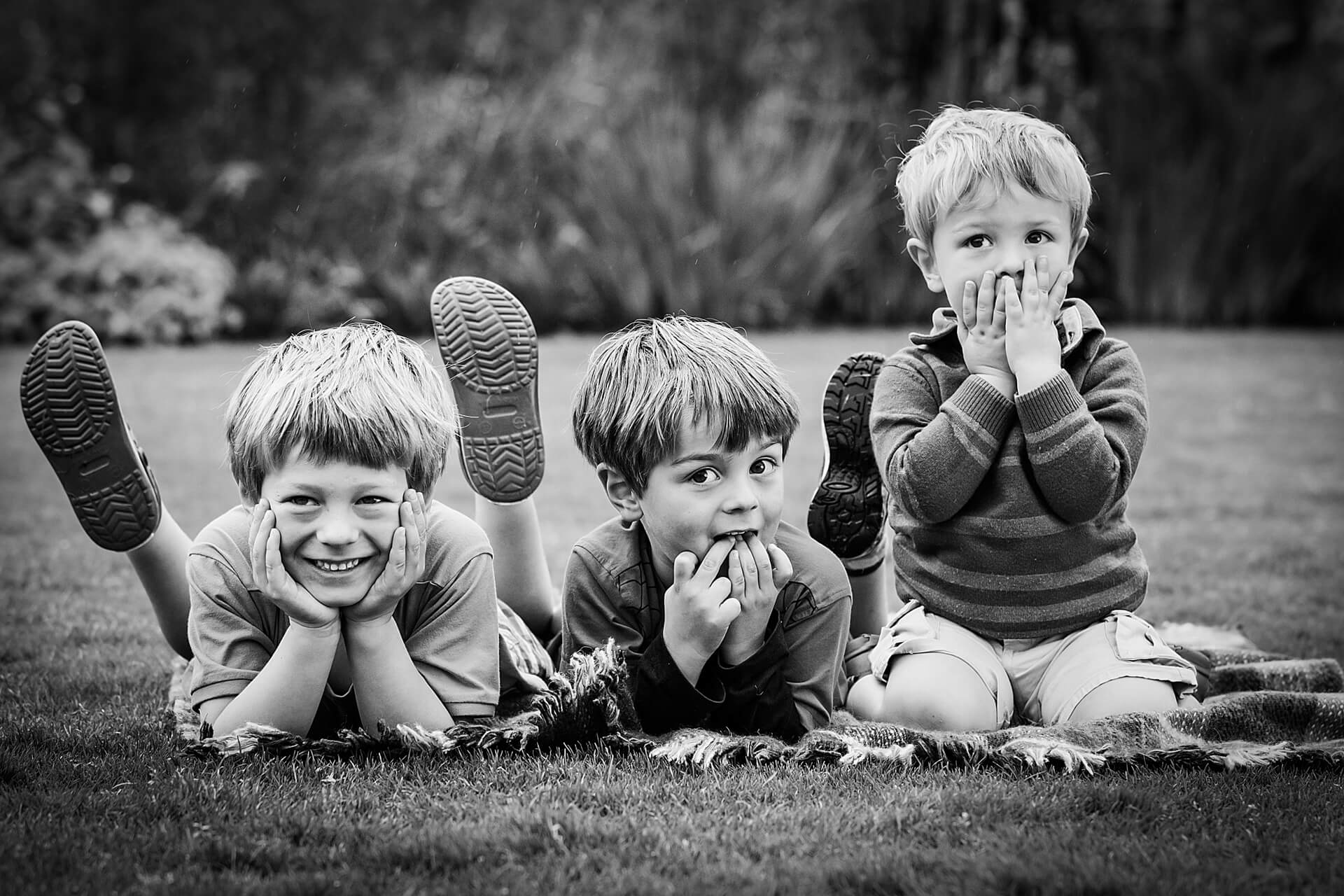 three boys laughing together