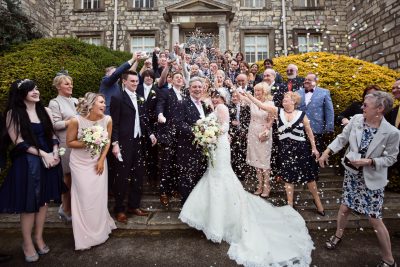 Bride and groom showered with confetti at Hazlewood Castle