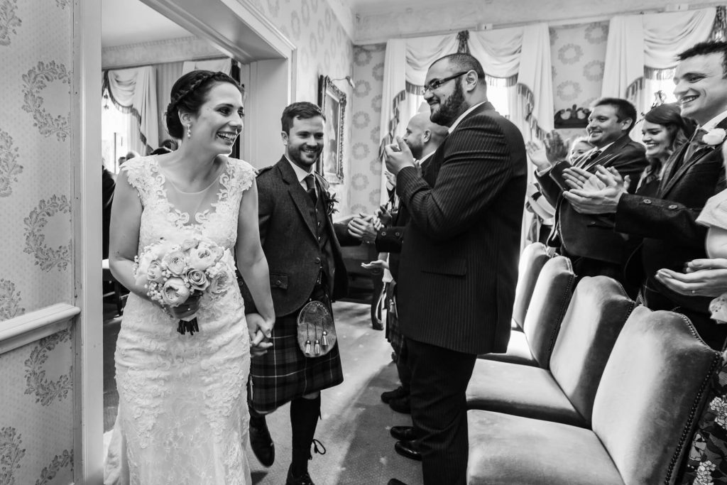 The Grange Hotel wedding photography - bride and groom leave the wedding ceremony room