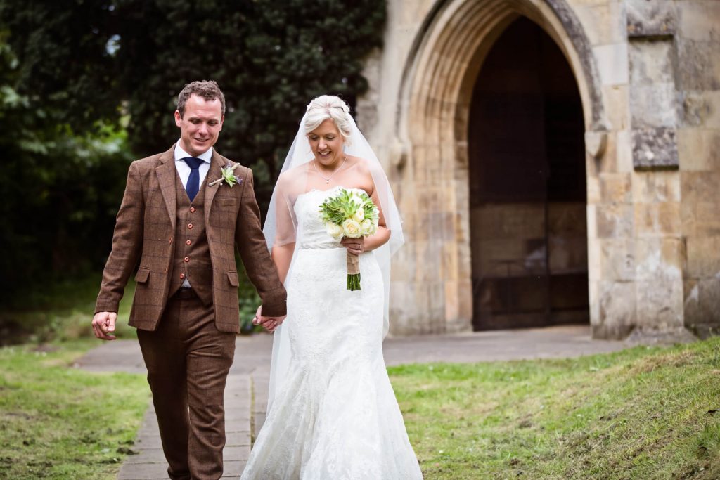 Wedding couple outside the church in Bolton Percy Yorkshire