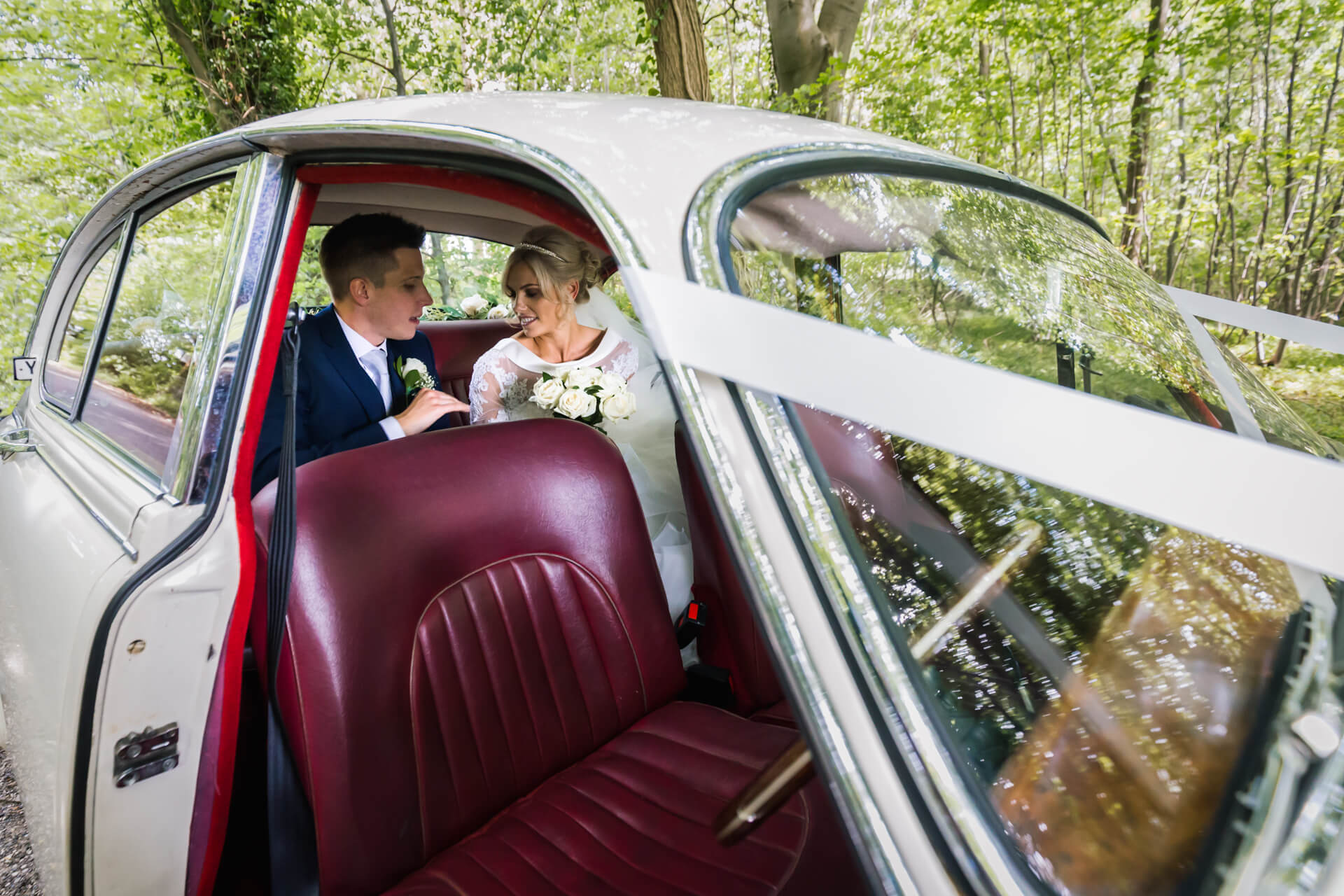 Wood Hall Hotel Wedding Photography - couple in the wedding car