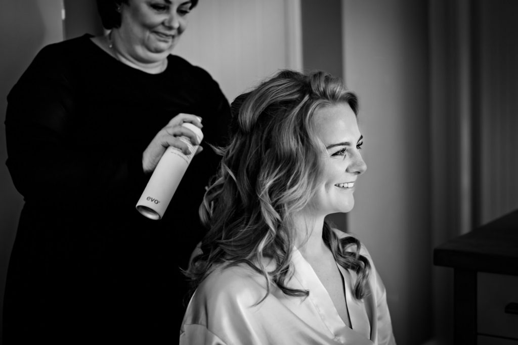 bridal preparations - bride having her hair done