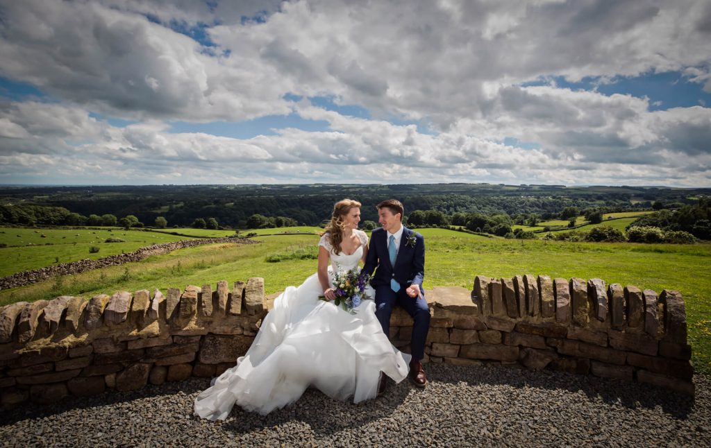 yorkshire dales wedding photographer - wedding couple in front of a hilltop view