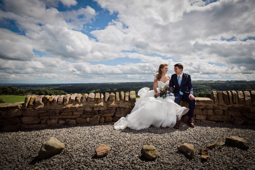 yorkshire dales wedding photographer - portrait of bride and groom in front of a sweeping Yorkshire view