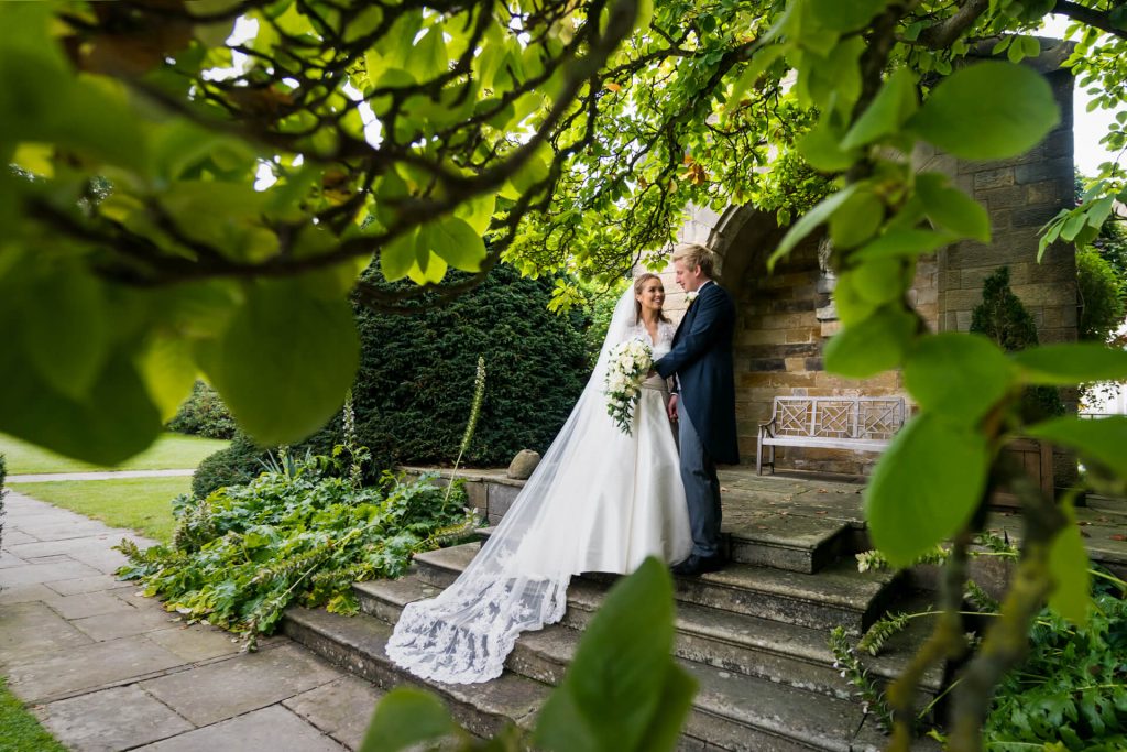 wedding couple on the steps at rudding park hotel