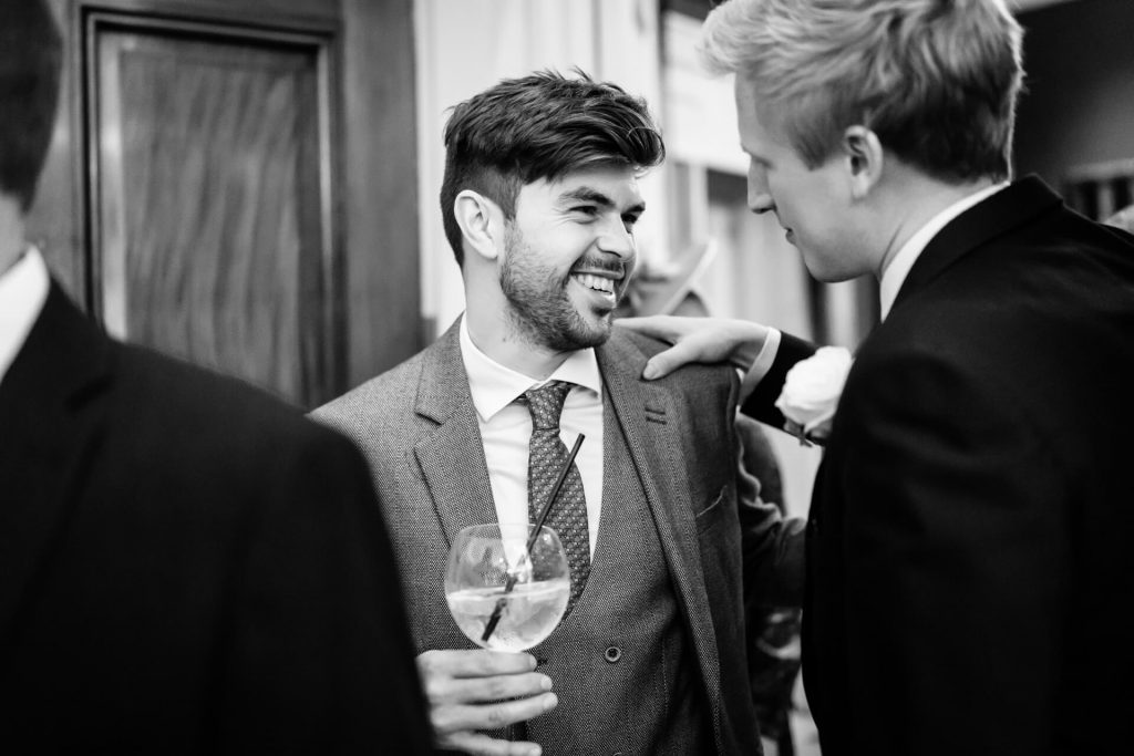groom greeting a guest