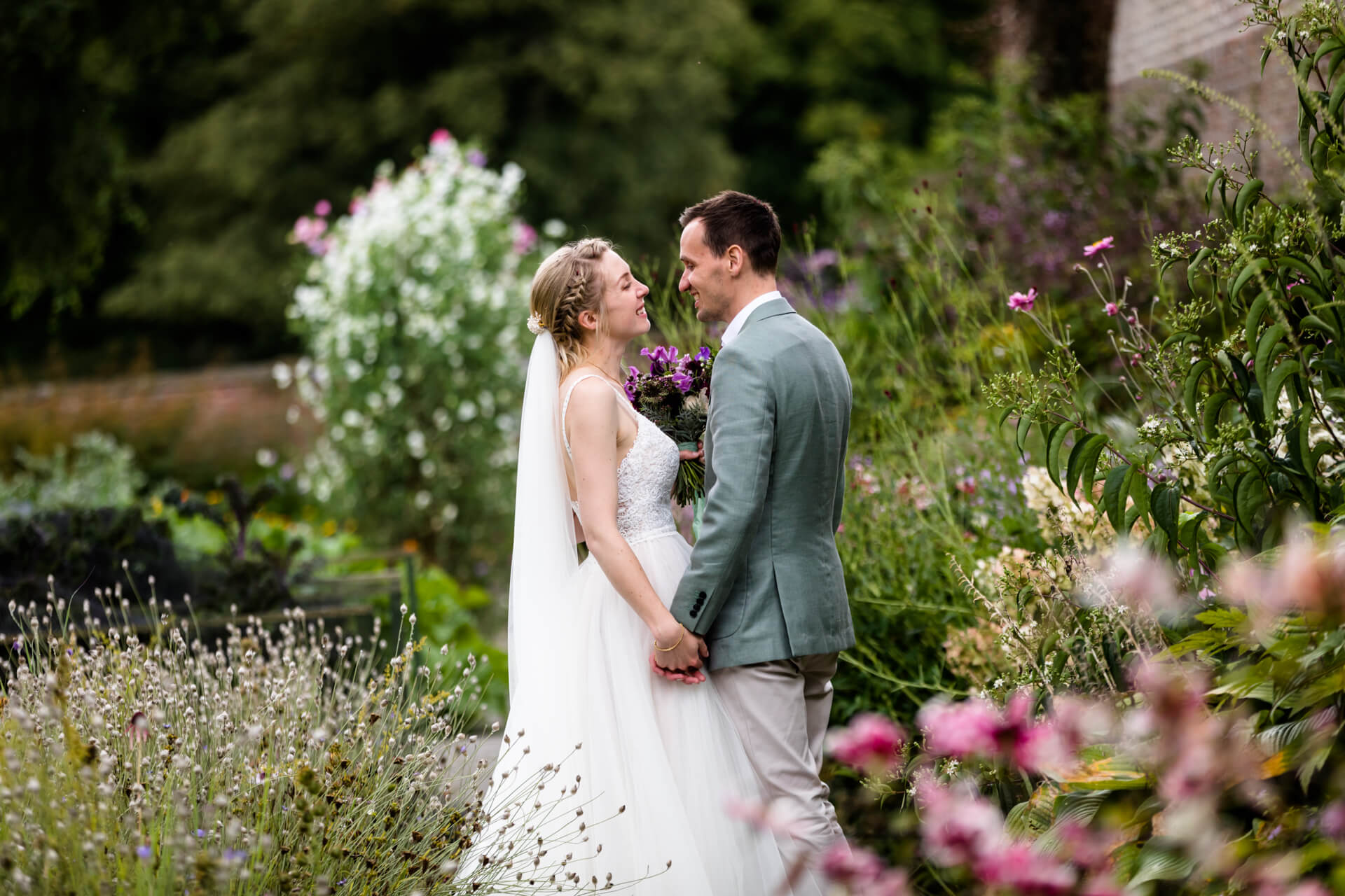 wedding couple laughing together in Middleton Lodge gardens