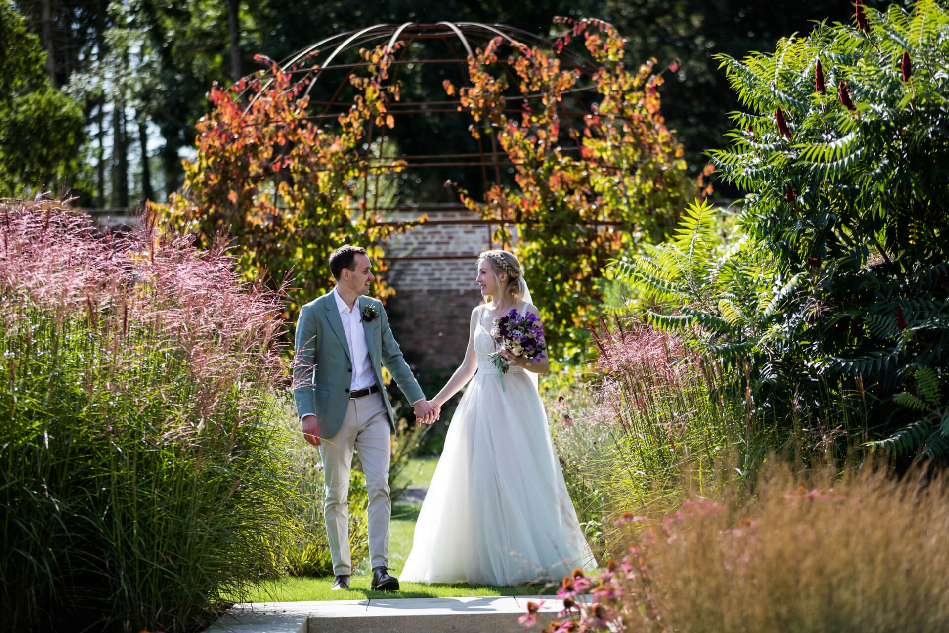 wedding couple walking in the grounds of Middleton Lodge