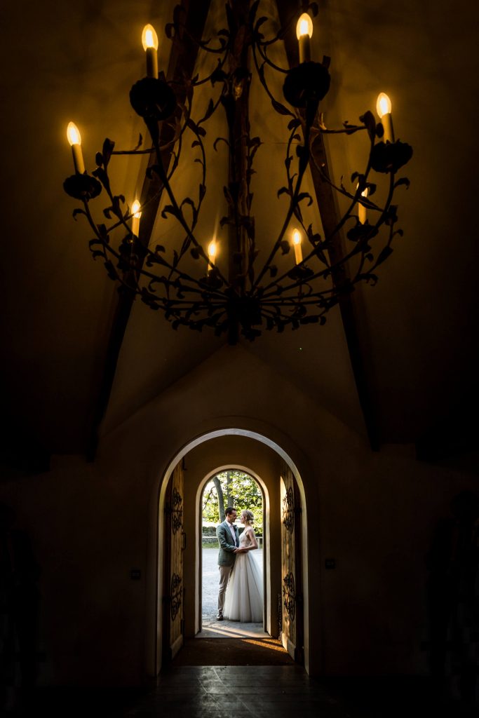 wedding couple standing in the doorway of the fig house