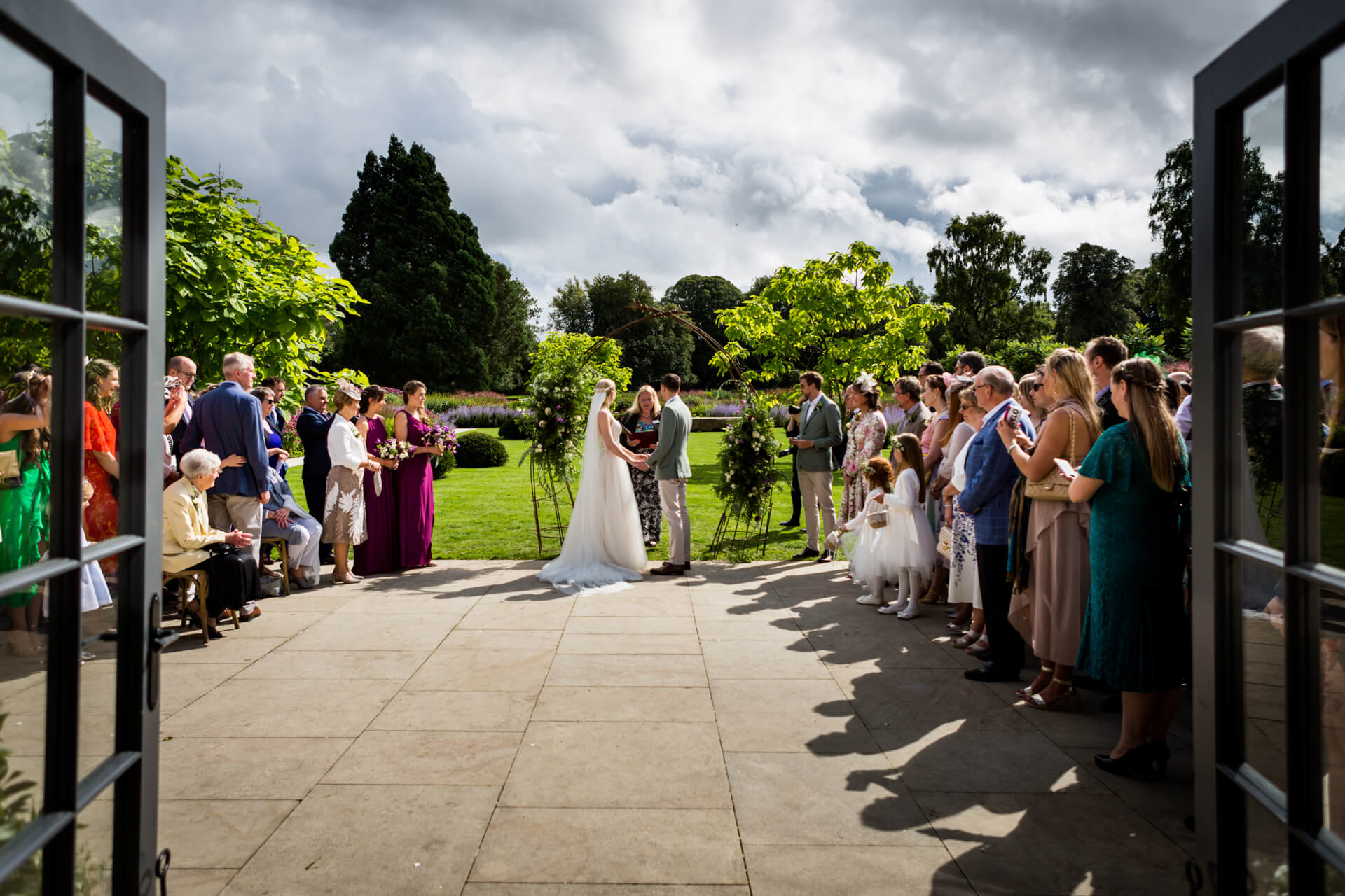 wedding ceremony in front of the fig house at Middleton Lodge