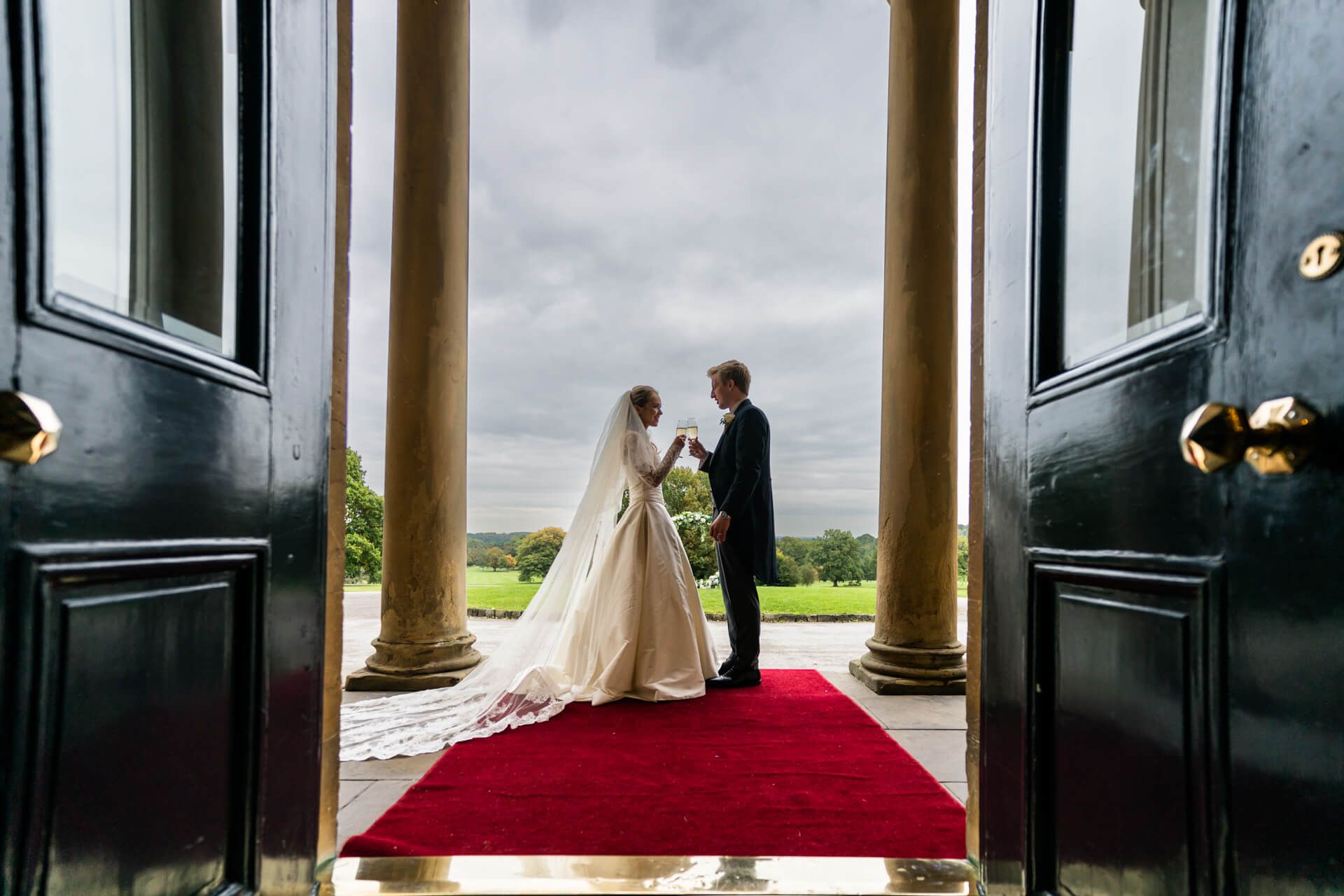 bride and groom in the doorway at rudding park