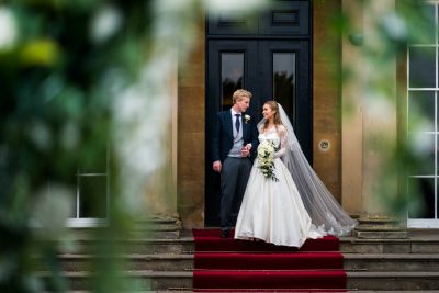 bride and groom on the steps at rudding park