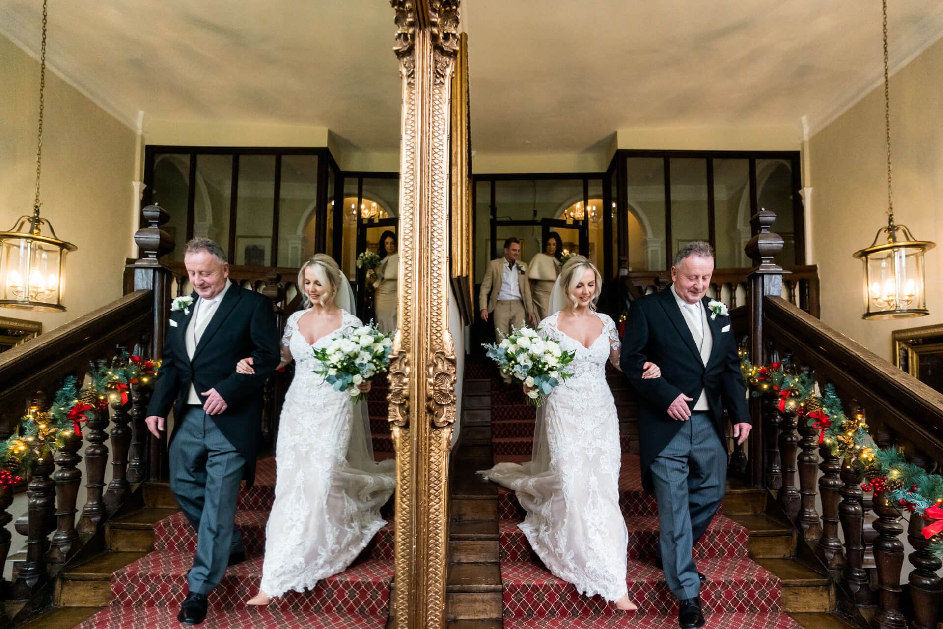 bride and her father walking down the stairs at Goldsborough Hall