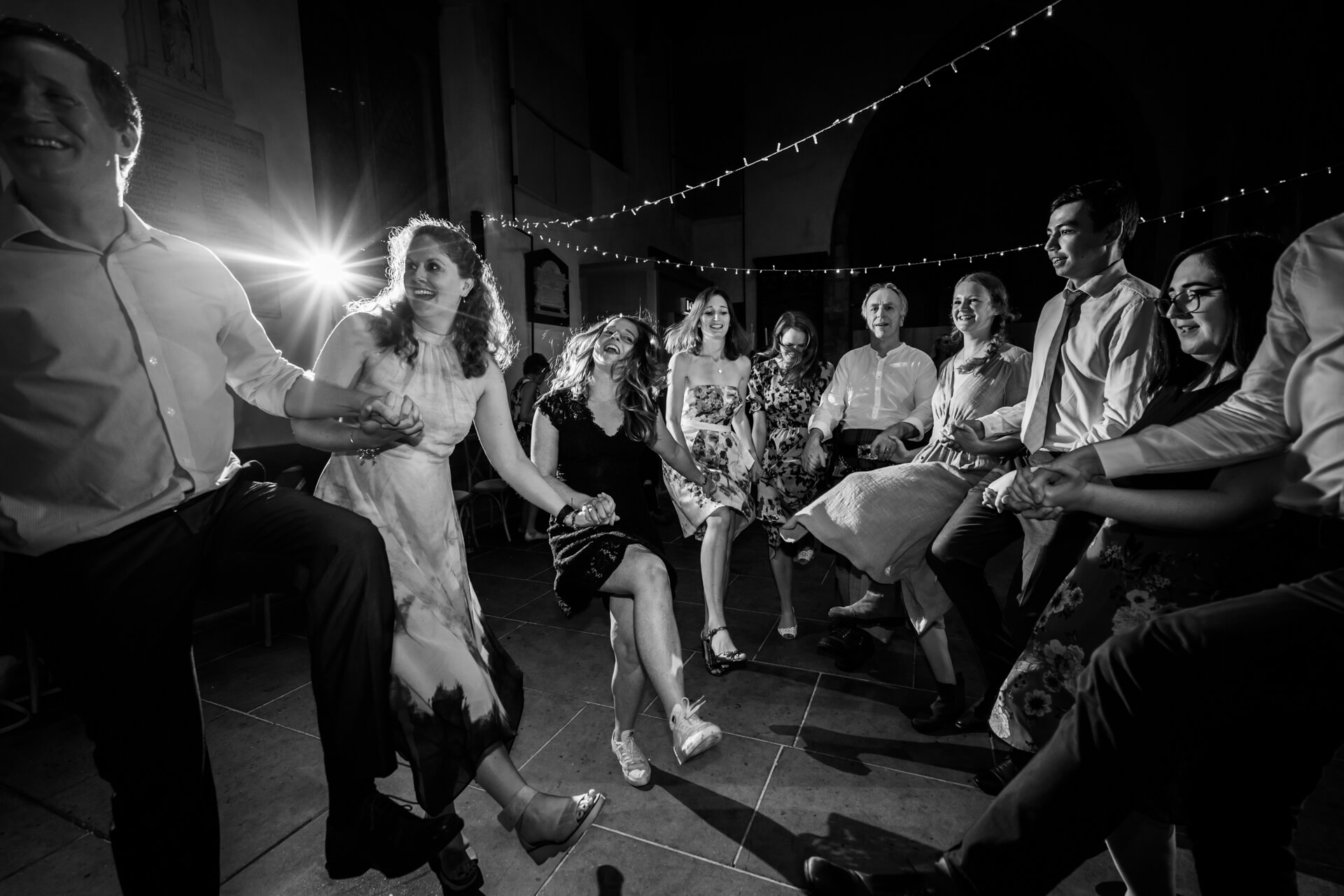 wedding guests dancing a ceilidh