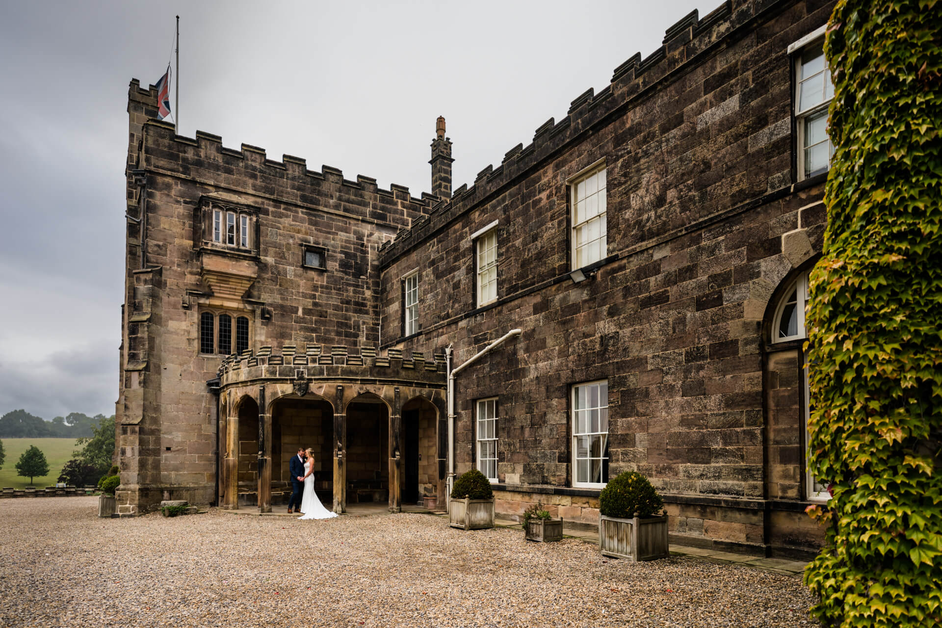 wedding couple in front of Ripley Castle