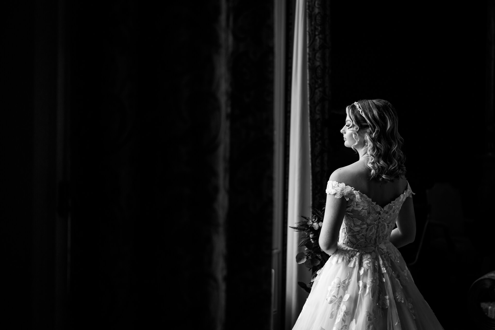 bride looking out the window at Allerton Castle