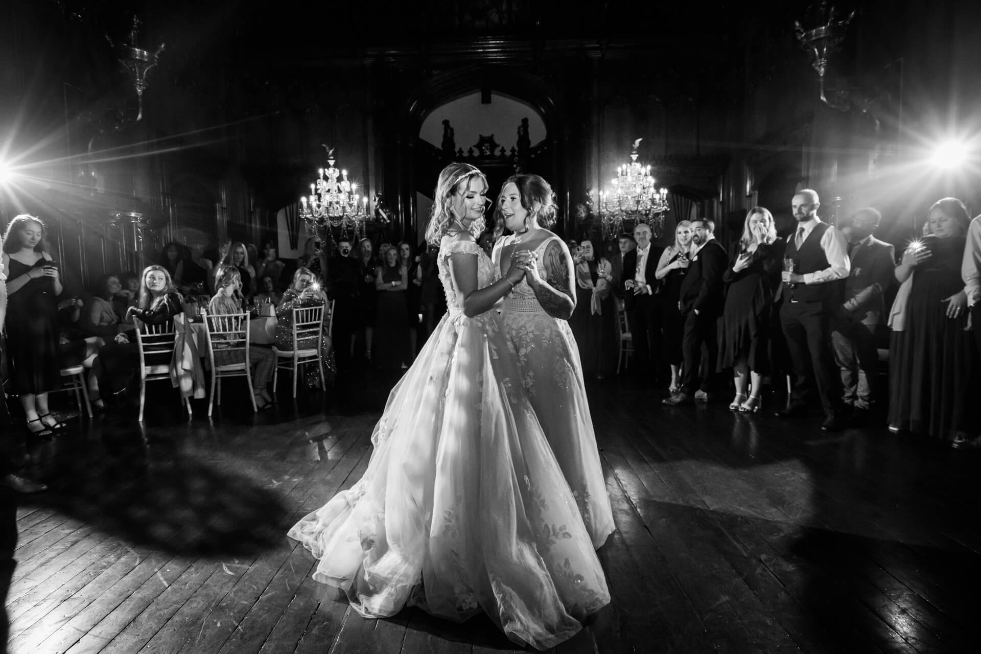 two brides dancing together at Allerton Castle