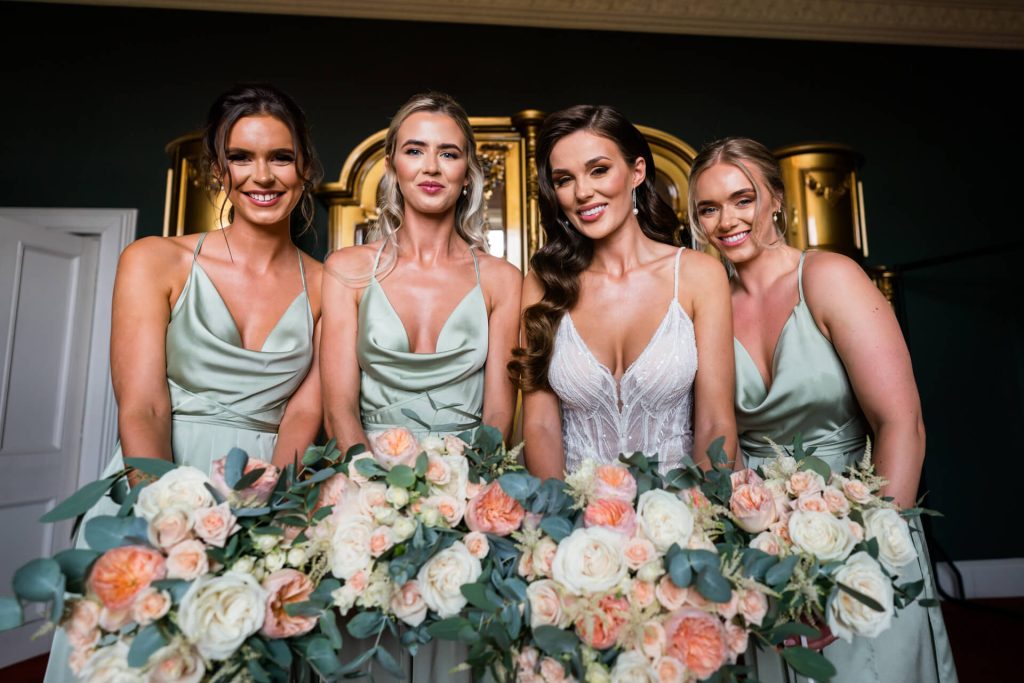 bride and bridesmaids holding their wedding bouquets