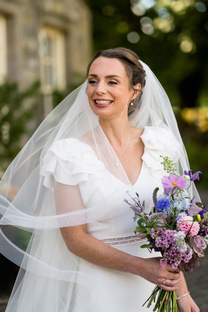portrait of the bride holding her bouquet