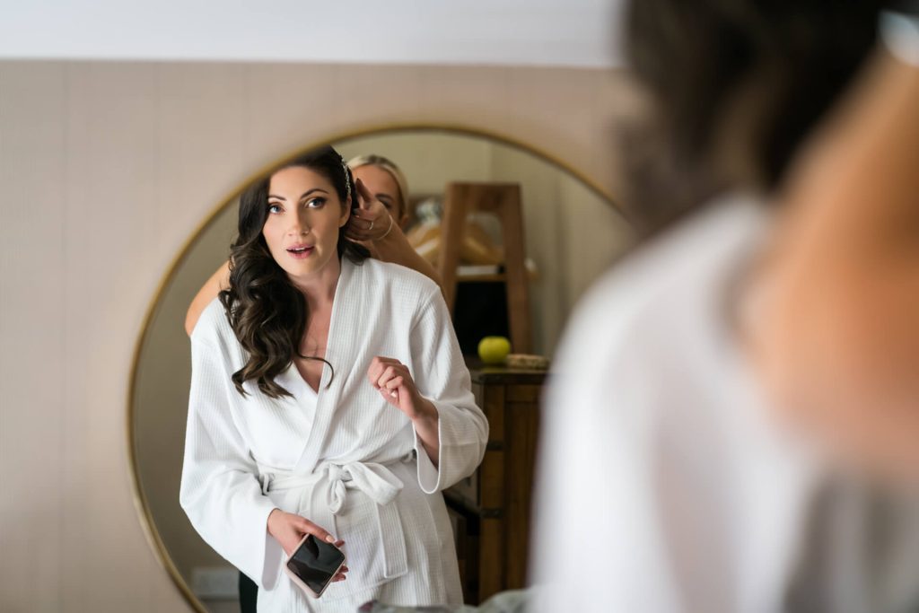 bride looking at herself in a mirror