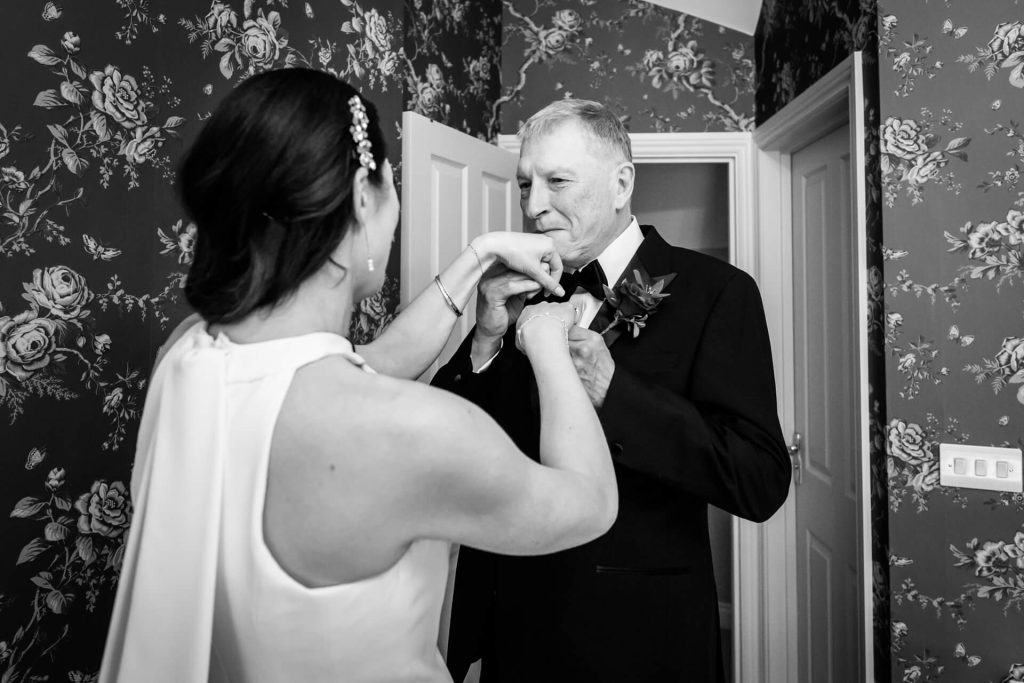 father of the bride kissing his daughter's hand