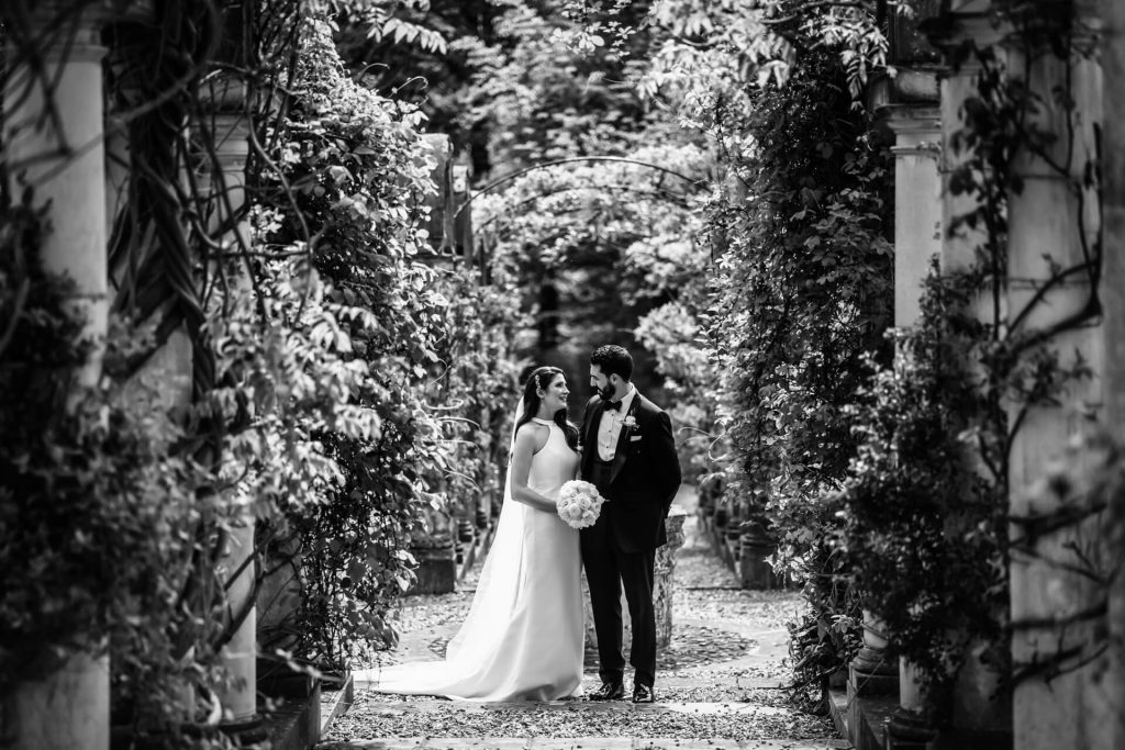 bride and groom chatting together in the gardens at the orangery at Settrington