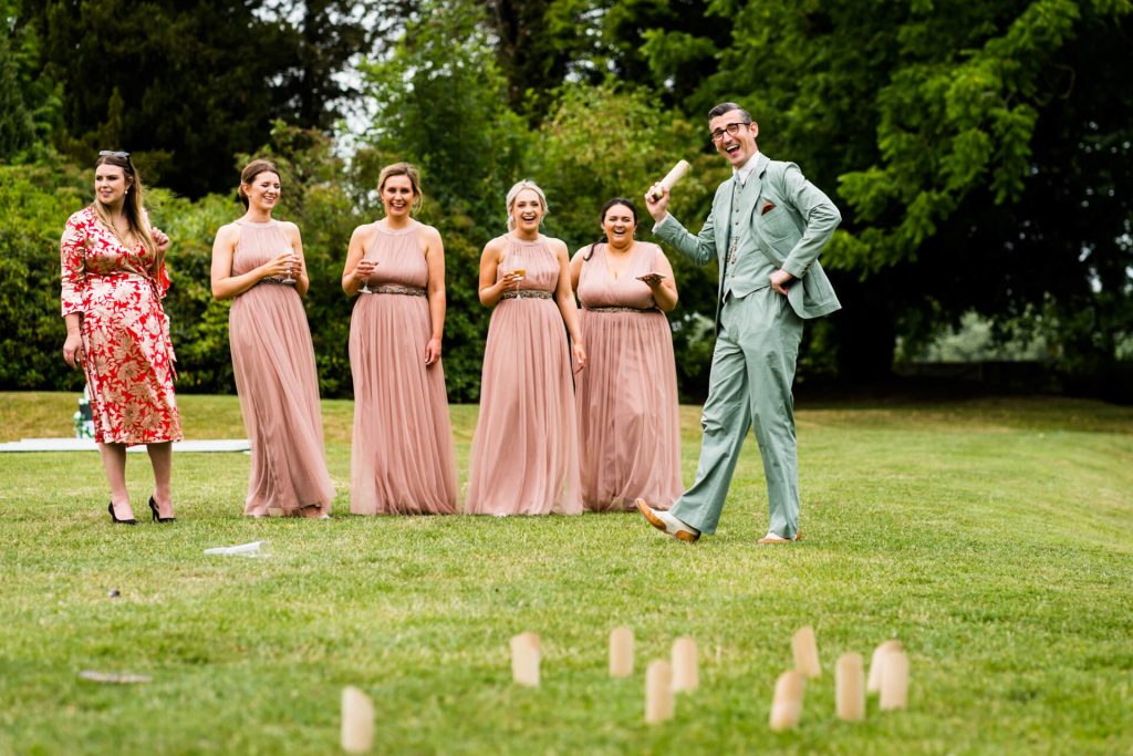 bridesmaids and guests playing lawn games at Thicket Priory