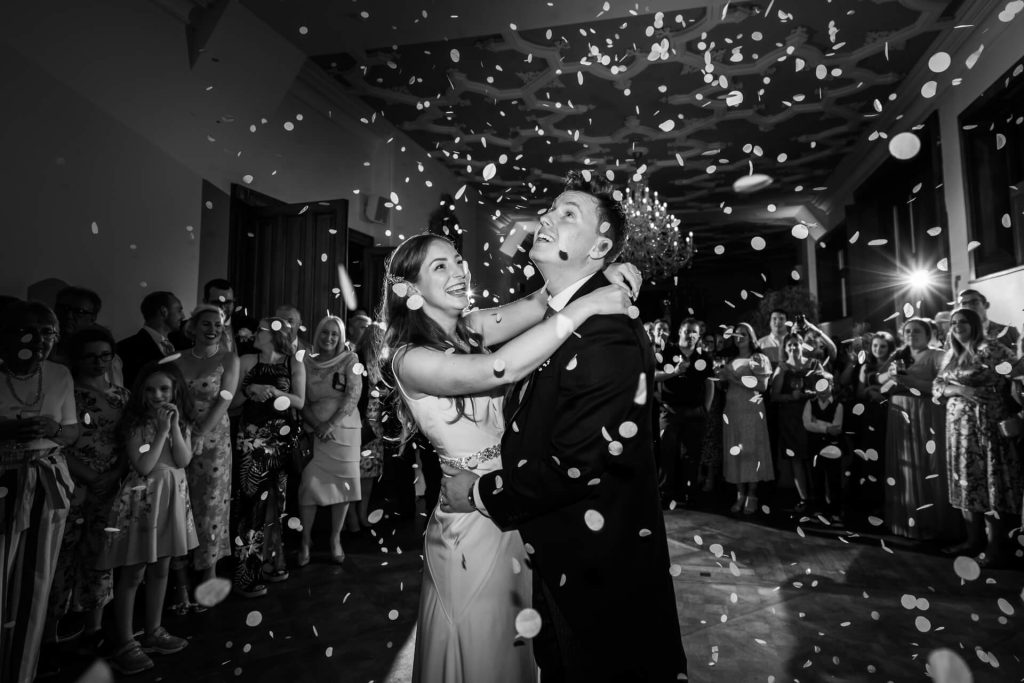 wedding couple are showered with confetti during their first dance at Thicket Priory
