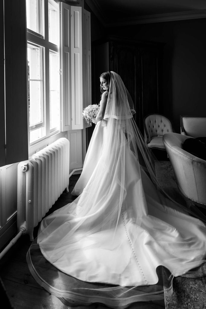 portrait of the bride by a window at Thicket Priory