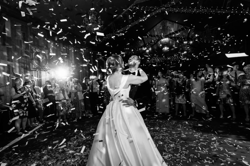 wedding couple dance under confetti at Wharfedale Grange