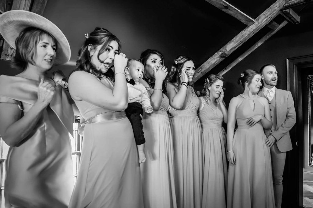 bridesmaids crying when seeing the bride in her dress