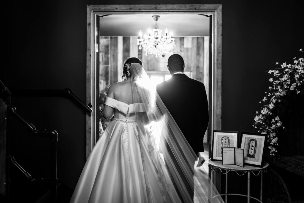 bride and groom walk out of the ceremony room