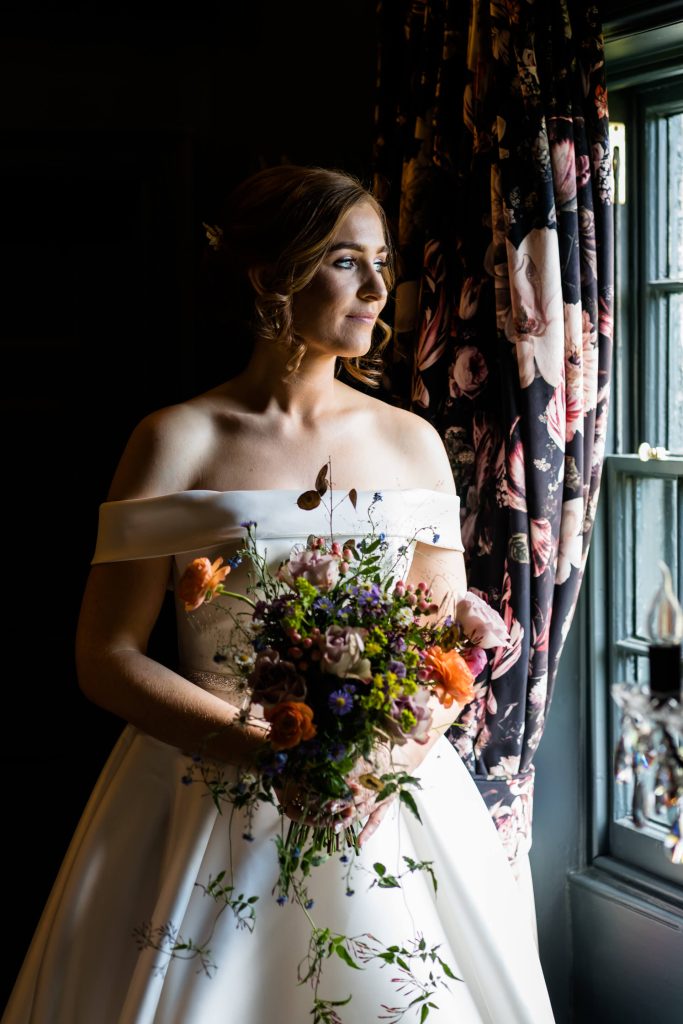bride looking out of a Wharfedale Grange window