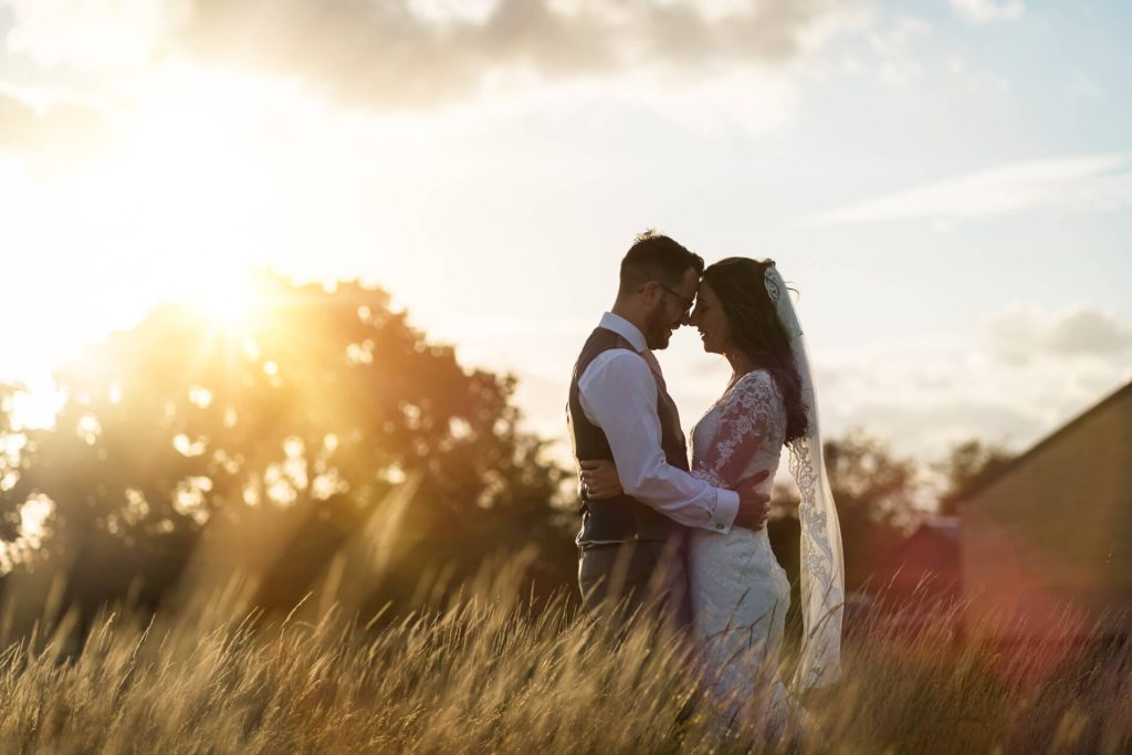 wedding couple hugging at sunset at Woodstock weddings and events