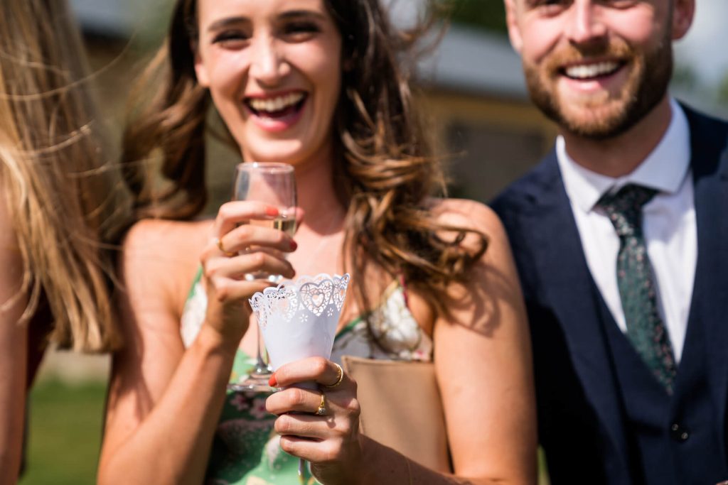 wedding guest holding a confetti cone