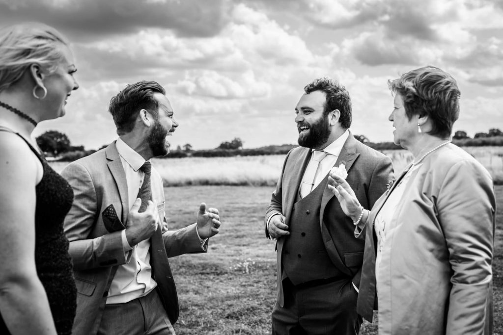 wedding guests laughing together