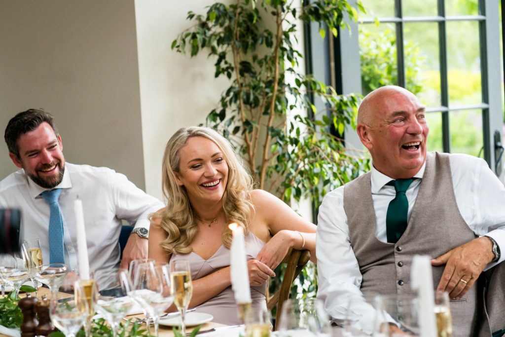 top table guests laughing