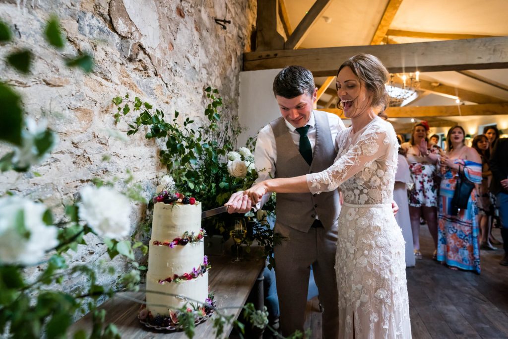 brigand groom cutting the cake