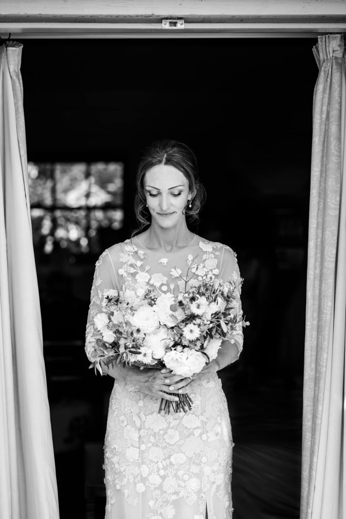 bride looking down at her flowers