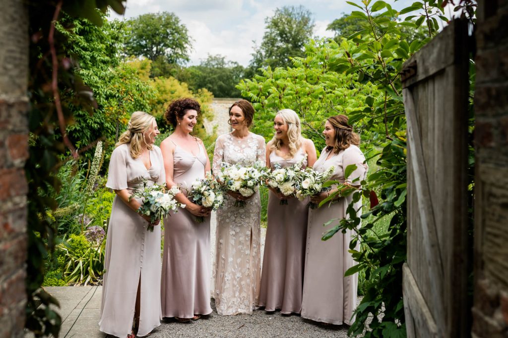 bridesmaids standing together chatting