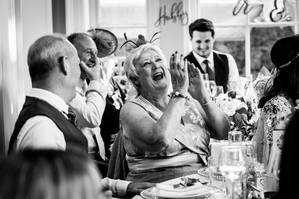 wedding guest laughing