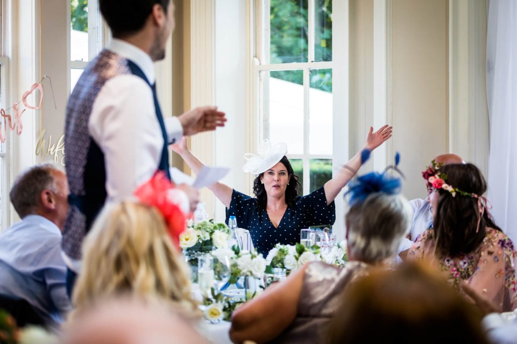 wedding guests reacting to a wedding speech