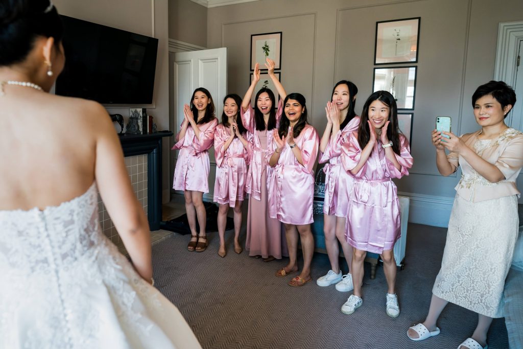 Bride and bridesmaids celebrating in matching silk robes.