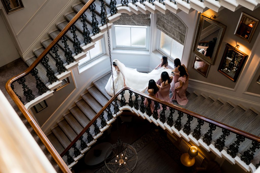 Bride and bridesmaids descending the grand staircase at The Principal York