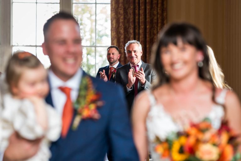 Joyful wedding scene with applauding guests