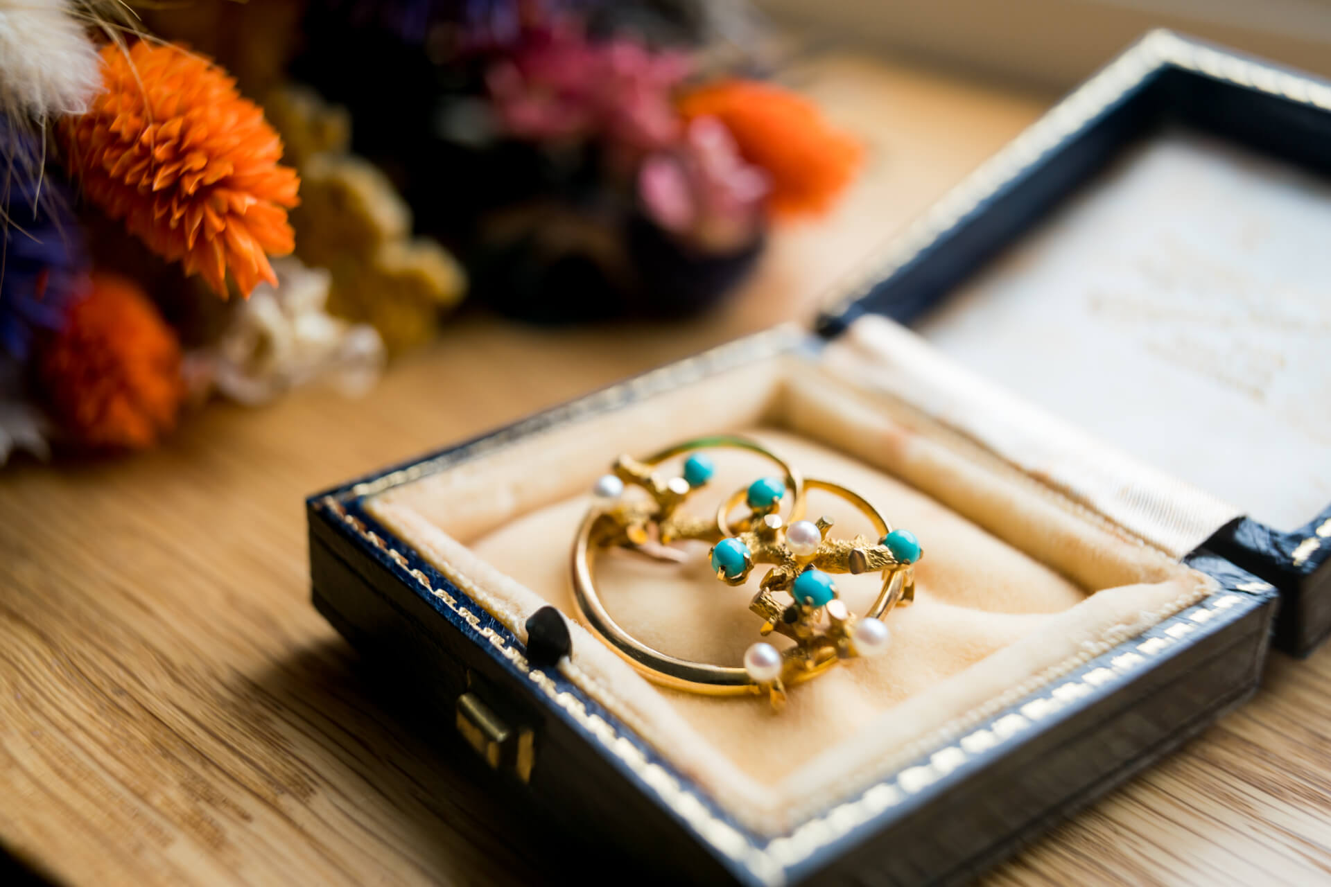 Vintage jewellery in ornate box with dried flowers